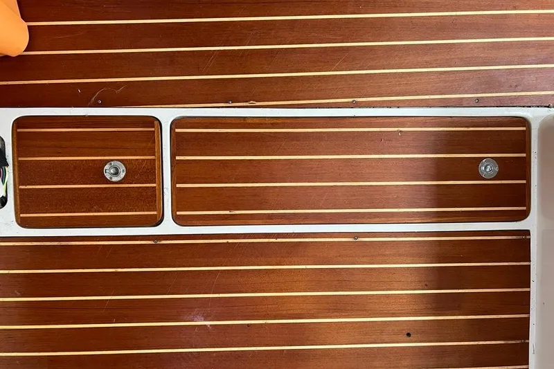 Slide: The Image of Teak wood flooring on a 1998 Catalina 36 MkII sailboat interior. - 34