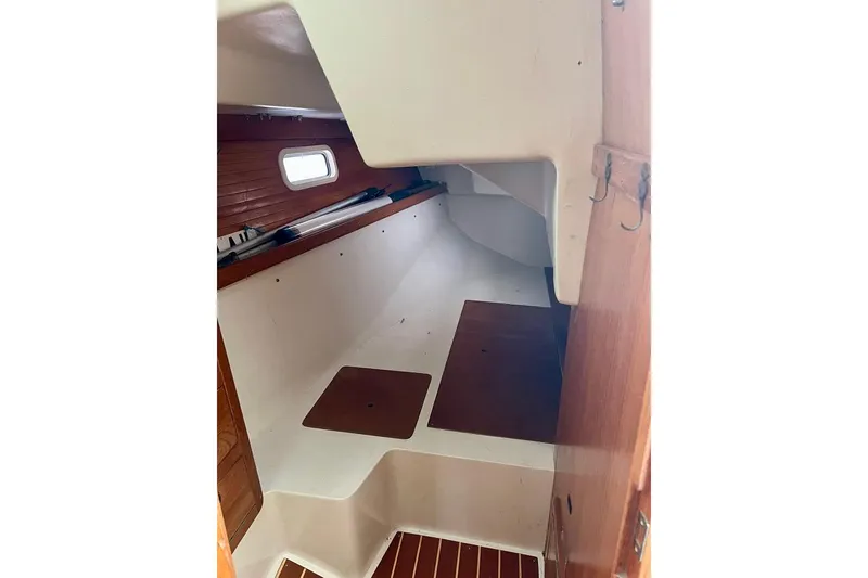 Slide: The Image of Interior cabin of 1998 Catalina 36 MkII sailboat, featuring wooden accents and compact design. - 39