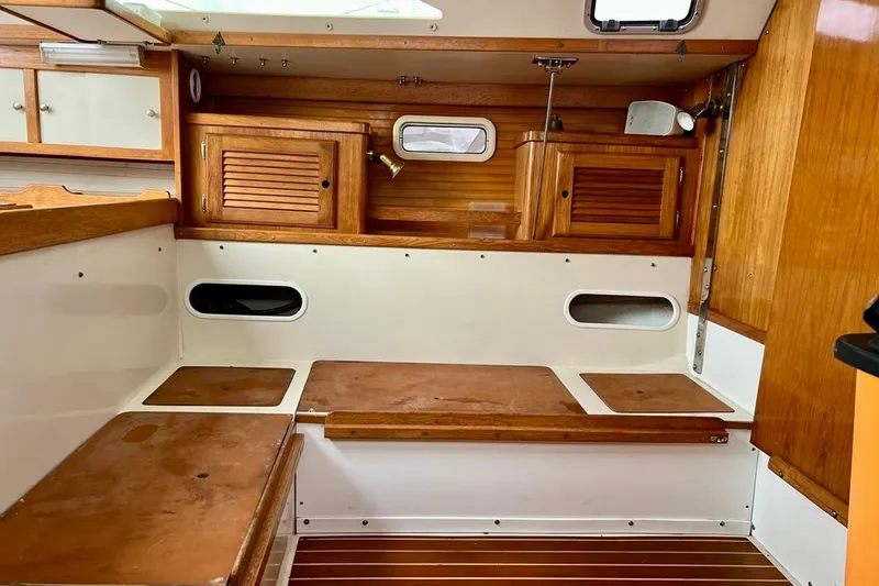 Slide: The Image of Interior of a 1998 Catalina 36 MkII sailboat with wooden cabinetry and seating. - 40
