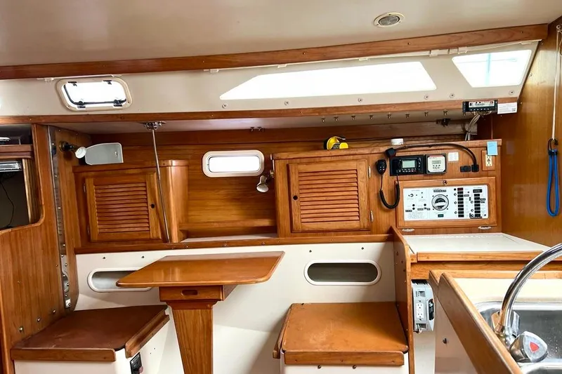 Slide: The Image of Interior of 1998 Catalina 36 MkII sailboat with wooden cabinetry and navigation equipment. - 41