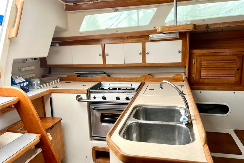 Slide: The Image of Interior of 1998 Catalina 36 MkII sailboat kitchen with stove and sink. - 43