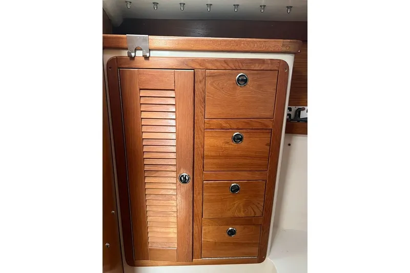 Slide: The Image of Wooden cabinet with drawers in a 1998 Catalina 36 MkII sailboat interior. - 48