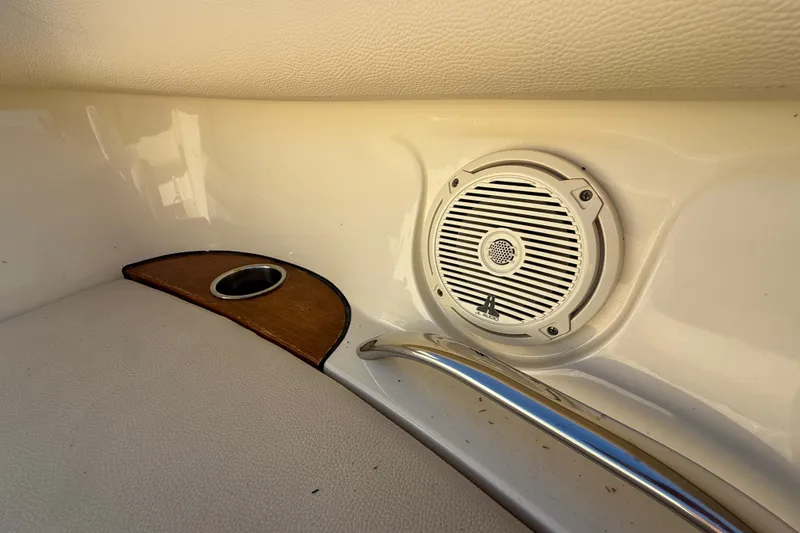 Slide: The Image of Interior of 2018 Chris-Craft Launch 30 featuring speaker and cup holder. - 17