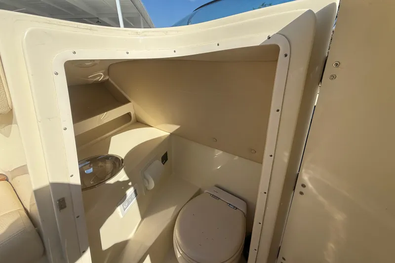Slide: The Image of 2018 Chris-Craft Launch 30 boat interior with compact bathroom and toilet. - 18