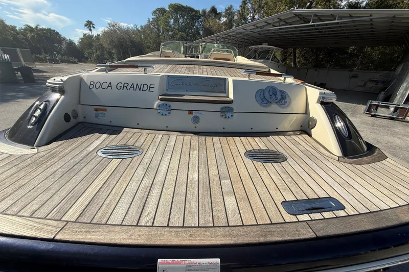 Slide: The Image of 2018 Chris-Craft Launch 30 boat with wooden deck, docked outdoors. - 6