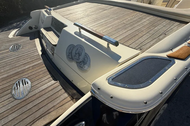 Slide: The Image of 2018 Chris-Craft Launch 30 boat with wooden deck and sleek design details. - 7