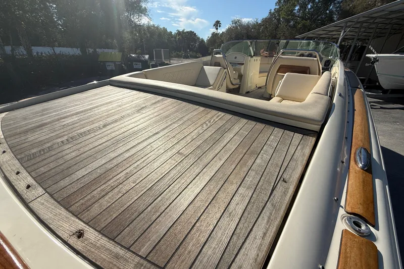 Slide: The Image of 2018 Chris-Craft Launch 30 boat with elegant wooden deck and luxurious seating. - 8