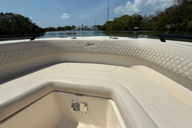 Slide: The Image of Luxurious interior of 2025 Scout 277 LXF boat with quilted seating and scenic water view. - 16
