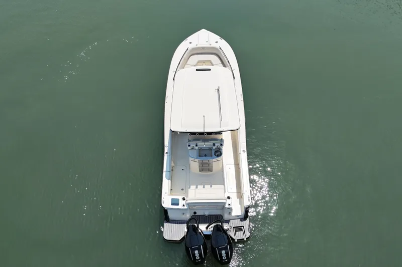 Slide: The Image of Aerial view of 2025 Scout 277 LXF boat on calm water. - 4