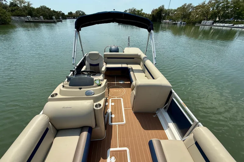 Slide: The Image of 2022 Hurricane FunDeck 2260 REF boat with spacious seating on calm water. - 13