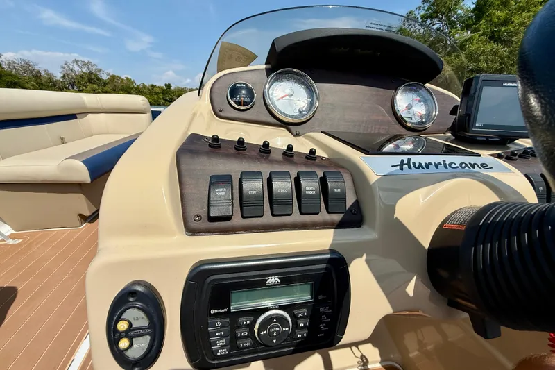 Slide: The Image of Dashboard of 2022 Hurricane FunDeck 2260 REF boat with controls and gauges. - 17