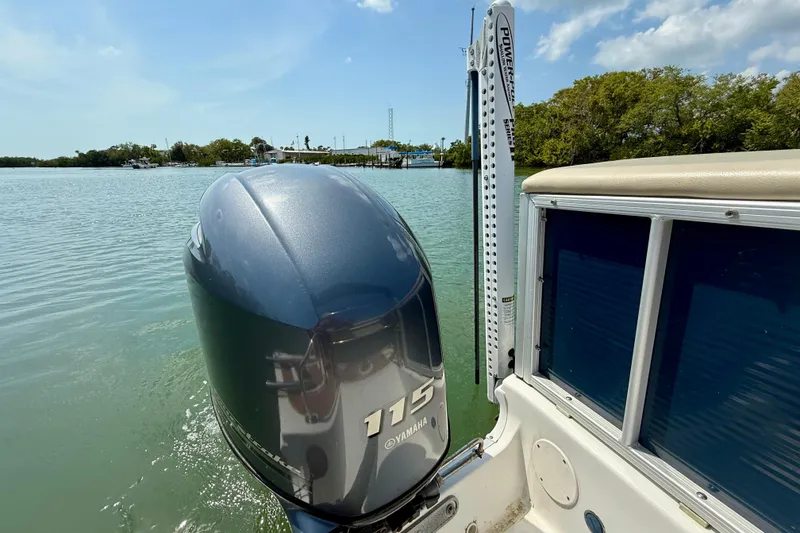 Slide: The Image of 2022 Hurricane FunDeck 2260 REF with Yamaha 115 engine on calm water. - 22