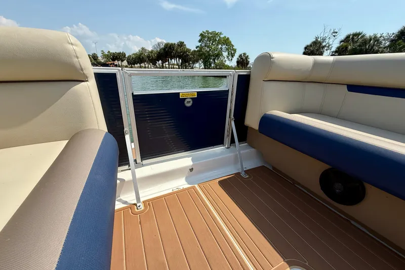 Slide: The Image of Interior view of 2022 Hurricane FunDeck 2260 REF boat with comfortable seating and scenic water backdrop. - 24