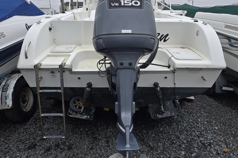 Slide: The Image of 2005 Sea Fox 210 Walk Around boat with V6 150 outboard motor, rear view. - 3