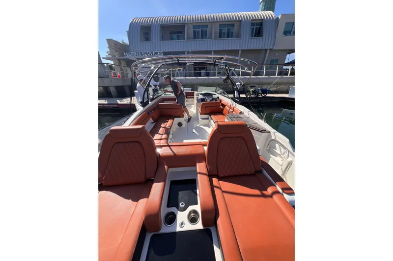 Slide: The Image of 2017 Sea Ray SDX 290 boat with luxurious seating at marina. - 5