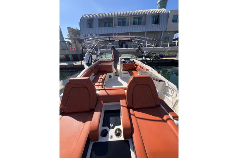 Slide: The Image of 2017 Sea Ray SDX 290 boat with luxurious seating at marina dock. - 9