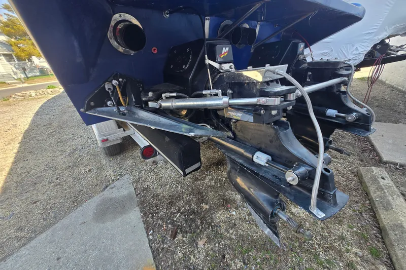 Slide: The Image of Rear view of a 2002 Avanti 41 boat with Mercury outboard motors. - 21