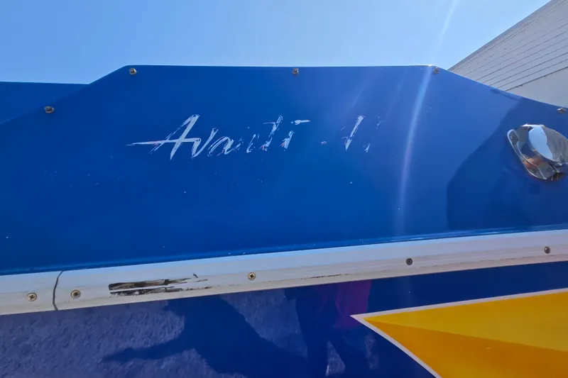 Slide: The Image of Blue Avanti 41 boat from 2002 with logo and yellow accent. - 24