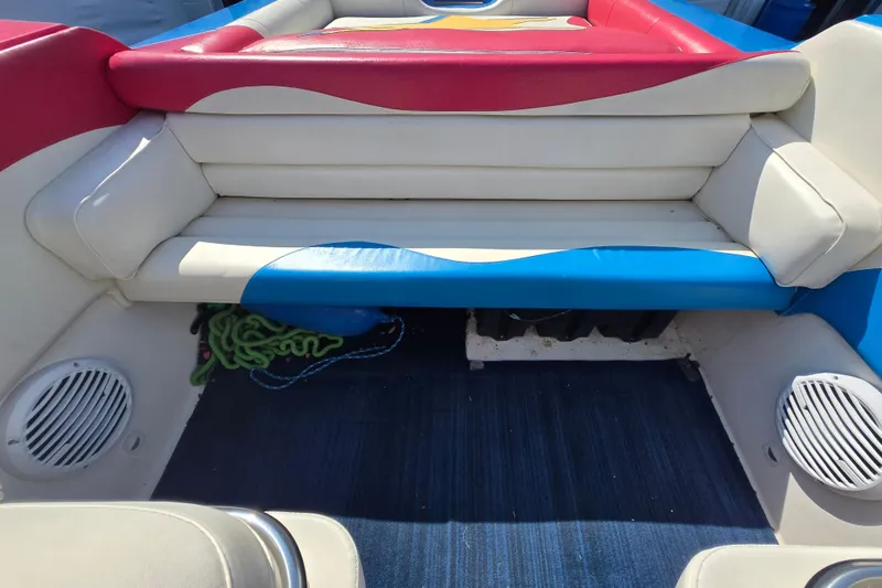 Slide: The Image of Interior of a 2002 Avanti 41 boat with colorful seating and marine speakers. - 25