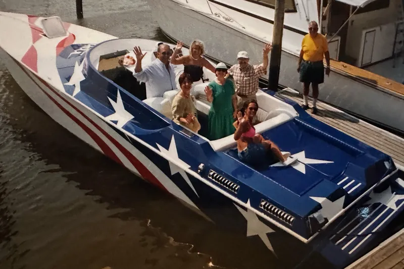 Slide: The Image of Colorful seating area on a 2002 Avanti 41 boat with star design upholstery. - 3
