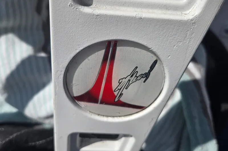 Slide: The Image of Close-up of Avanti 41 logo on a white surface, featuring a red design, 2002 model. - 31