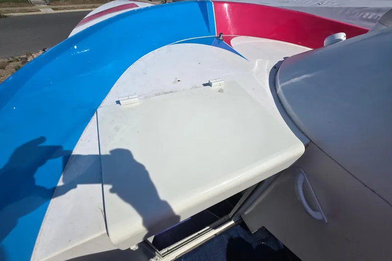 Slide: The Image of 2002 Avanti 41 boat deck with vibrant blue and red accents. - 39