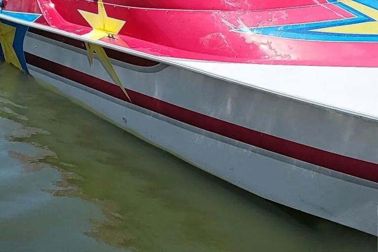 Slide: The Image of Interior of a 2002 Avanti 41 boat with blue and white seating and carpet. - 4