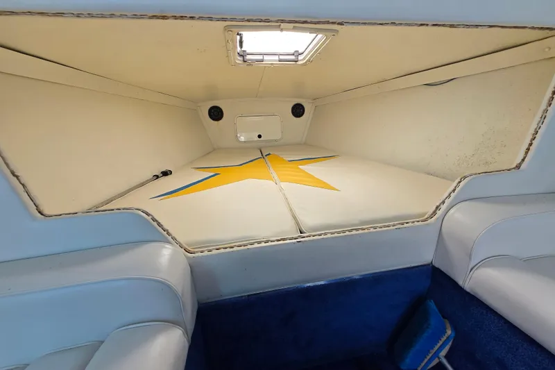 Slide: The Image of Interior cabin of a 2002 Avanti 41 boat with star design on cushions. - 43