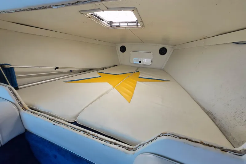 Slide: The Image of Interior cabin of a 2002 Avanti 41 boat with star design on cushions. - 48