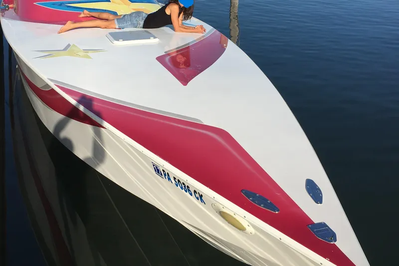 Slide: The Image of Twin engines in a 2002 Avanti 41 boat, showcasing detailed mechanical components. - 5