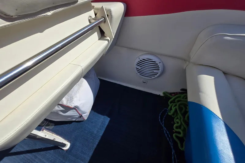 Slide: The Image of Interior of a 2002 Avanti 41 boat, featuring seating and a speaker. - 52
