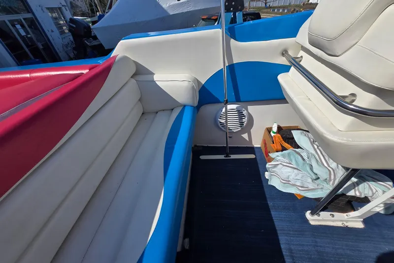 Slide: The Image of Interior of a 2002 Avanti 41 boat with colorful seating and storage area. - 53
