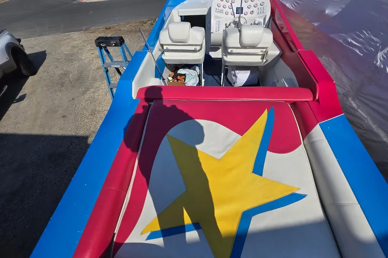 Slide: The Image of Colorful interior of a 2002 Avanti 41 boat with star design upholstery. - 55