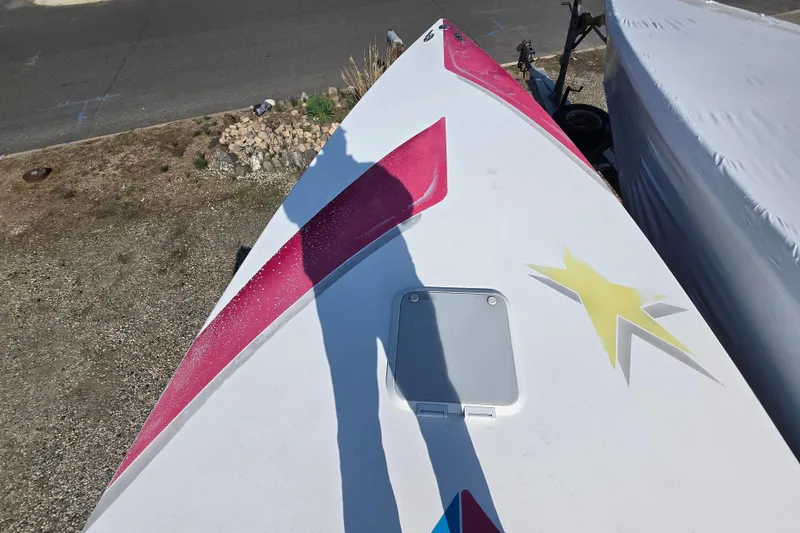 Slide: The Image of Bow of a 2002 Avanti 41 boat with colorful graphics and a star design. - 60