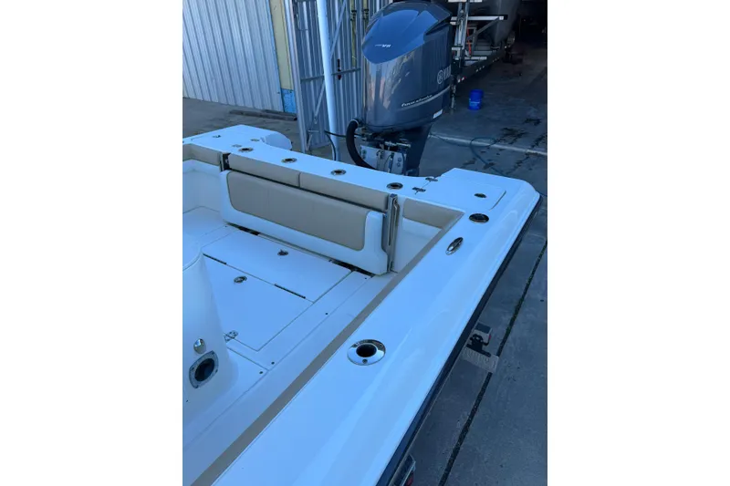 Slide: The Image of 2016 ShearWater 27 Carolina boat with Yamaha outboard motor, docked in a marina. - 4