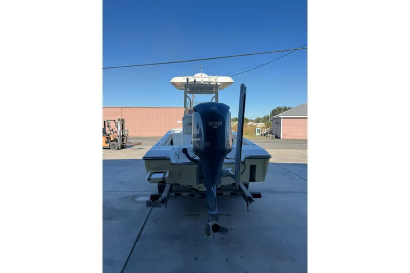 Slide: The Image of 2016 ShearWater 27 Carolina boat with Yamaha 350 engine, parked outdoors. - 9