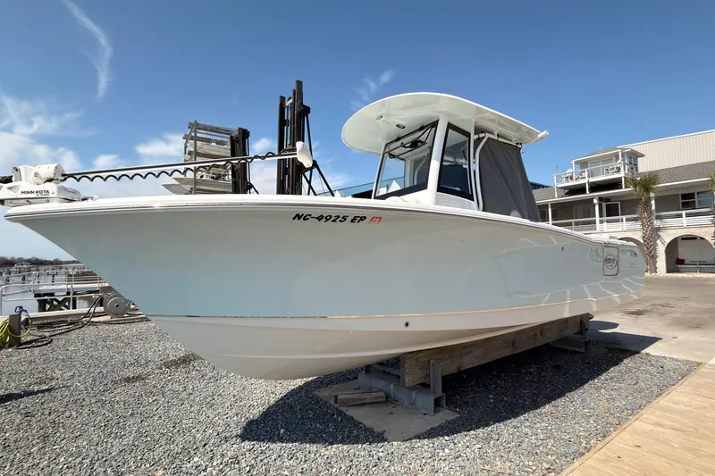The Image of 2020 Sea Hunt Ultra 255 SE boat on display at a marina. - 0
