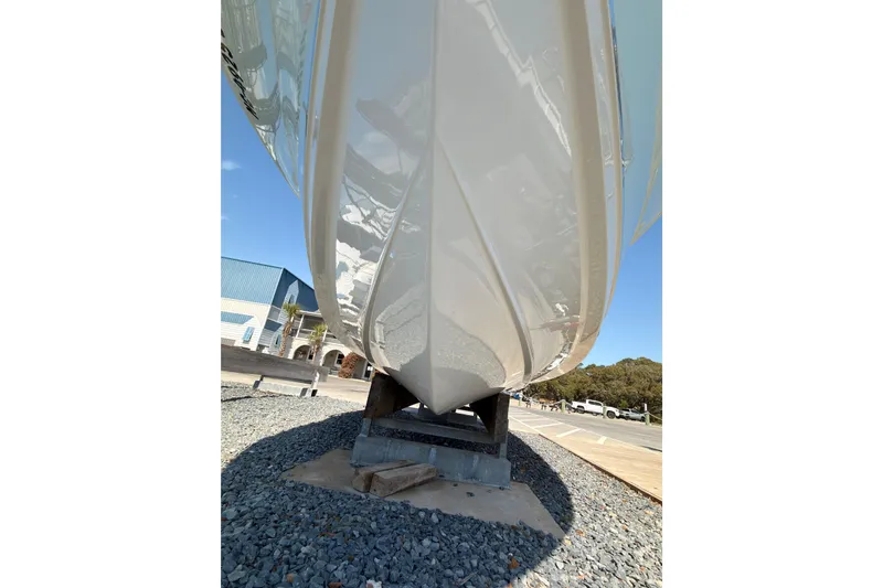 Slide: The Image of 2020 Sea Hunt Ultra 255 SE boat hull on display outdoors. - 30