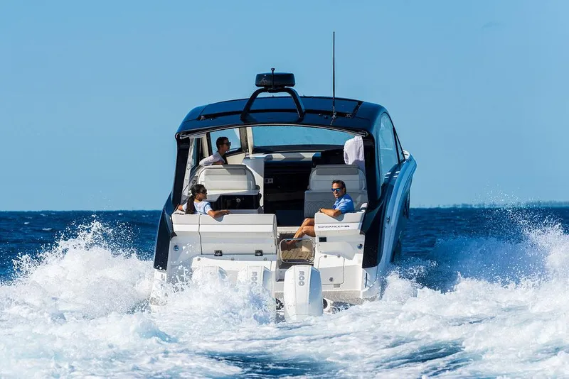 Slide: The Image of Manufacturer Provided Image: 2022 Sea Ray Sundancer 370 OB cruising with passengers on a sunny day. - 2