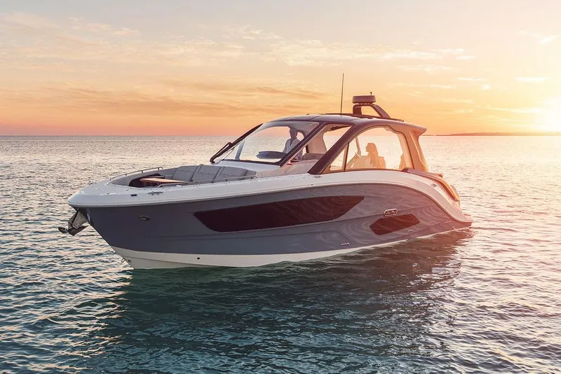 Slide: The Image of Manufacturer Provided Image: 2022 Sea Ray Sundancer 370 OB boat on calm water at sunset. - 3