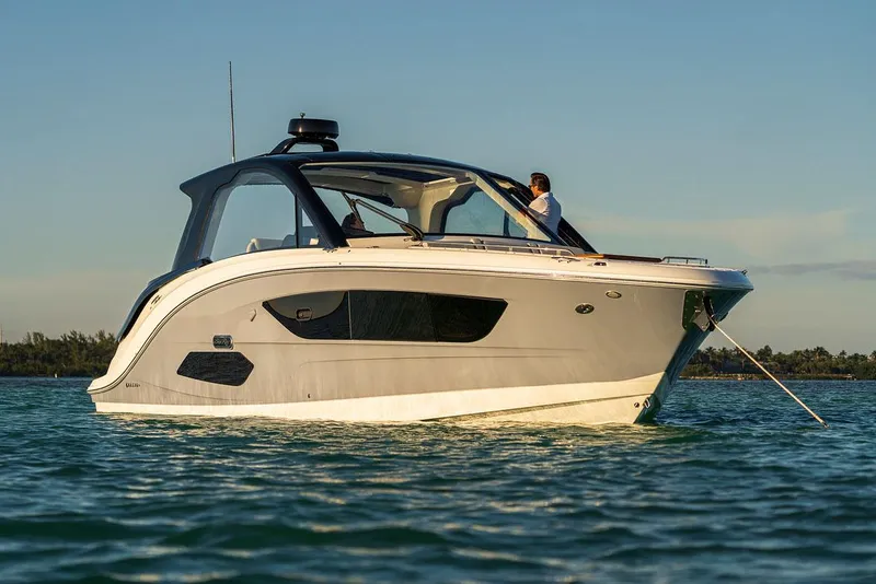 Slide: The Image of Manufacturer Provided Image: 2022 Sea Ray Sundancer 370 OB luxury motorboat on calm water. - 4