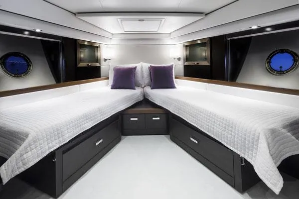 Slide: The Image of Manufacturer Provided Image: Luxurious bedroom interior of 2016 Tiara Yachts 50 Coupe with twin beds and modern decor. - 14