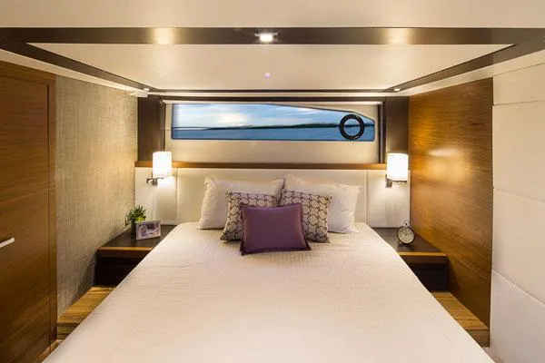 Slide: The Image of Manufacturer Provided Image: Luxurious bedroom interior of 2016 Tiara Yachts 50 Coupe with modern decor and ocean view. - 15