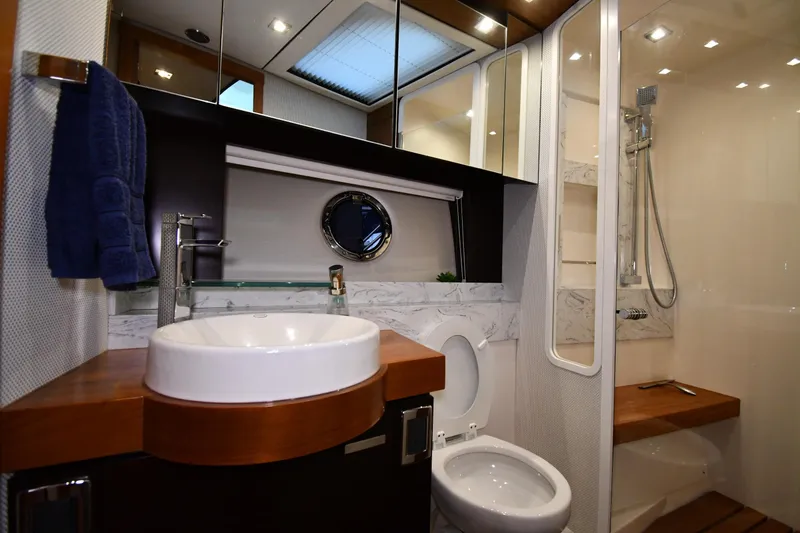 Slide: The Image of Luxurious bathroom in 2016 Tiara Yachts 50 Coupe with modern fixtures and elegant design. - 23