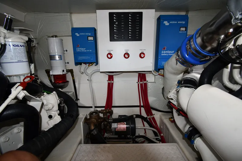 Slide: The Image of Engine room of 2016 Tiara Yachts 50 Coupe with Volvo components and Victron Energy chargers. - 67