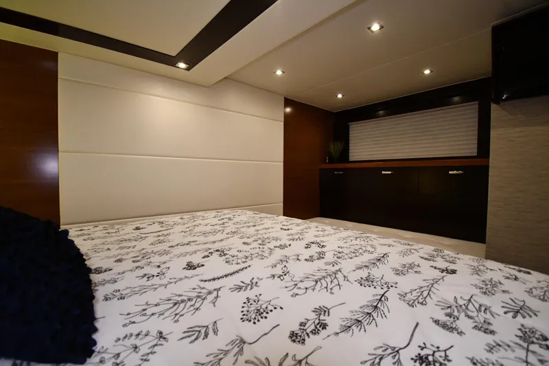 Slide: The Image of Luxurious interior of 2016 Tiara Yachts 50 Coupe, featuring elegant bedding and modern design. - 29