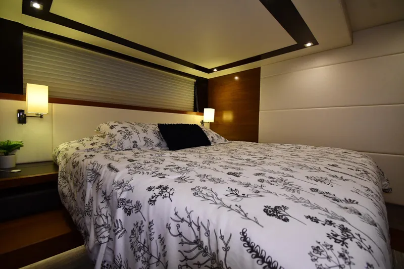 Slide: The Image of Luxurious bedroom interior of 2016 Tiara Yachts 50 Coupe with elegant bedding and ambient lighting. - 30