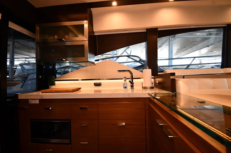 Slide: The Image of Luxurious kitchen interior of 2016 Tiara Yachts 50 Coupe, featuring modern cabinetry and sleek design. - 34
