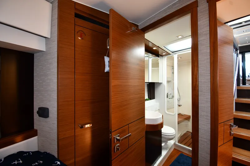 Slide: The Image of Luxurious 2016 Tiara Yachts 50 Coupe interior with modern bathroom and wooden finishes. - 30
