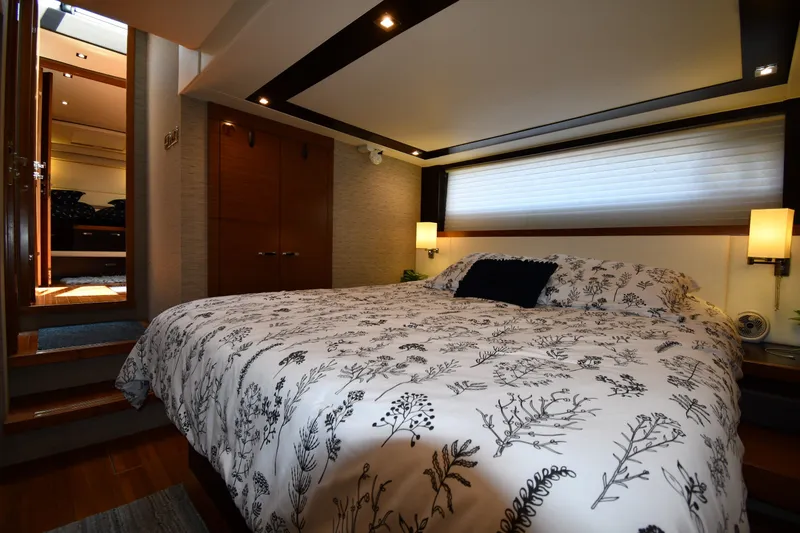 Slide: The Image of Luxurious bedroom interior of 2016 Tiara Yachts 50 Coupe with elegant bedding and ambient lighting. - 36